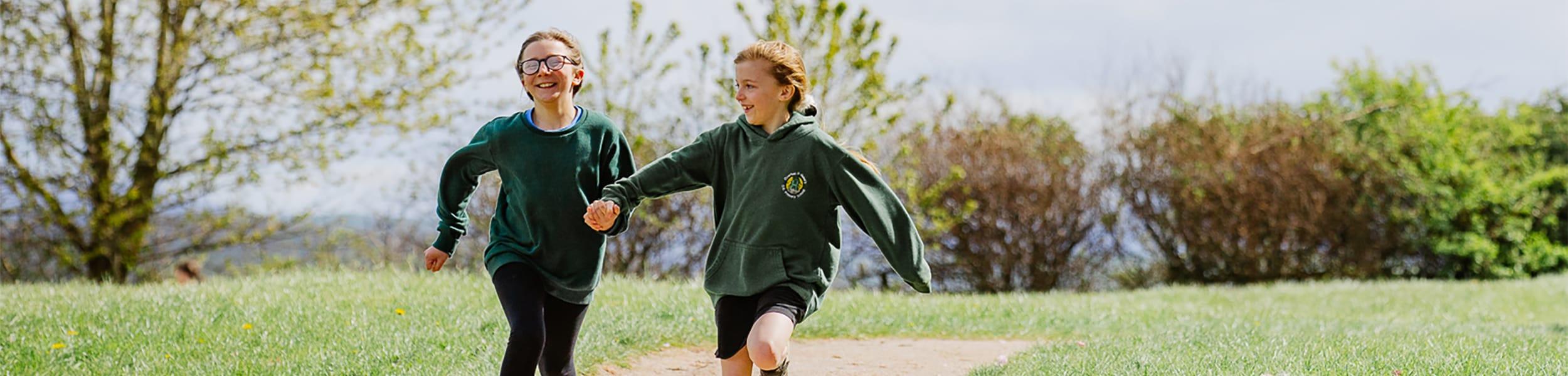children running holding hands